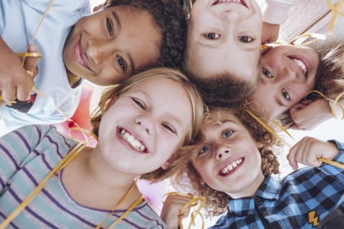 kids-in-circle-smiling